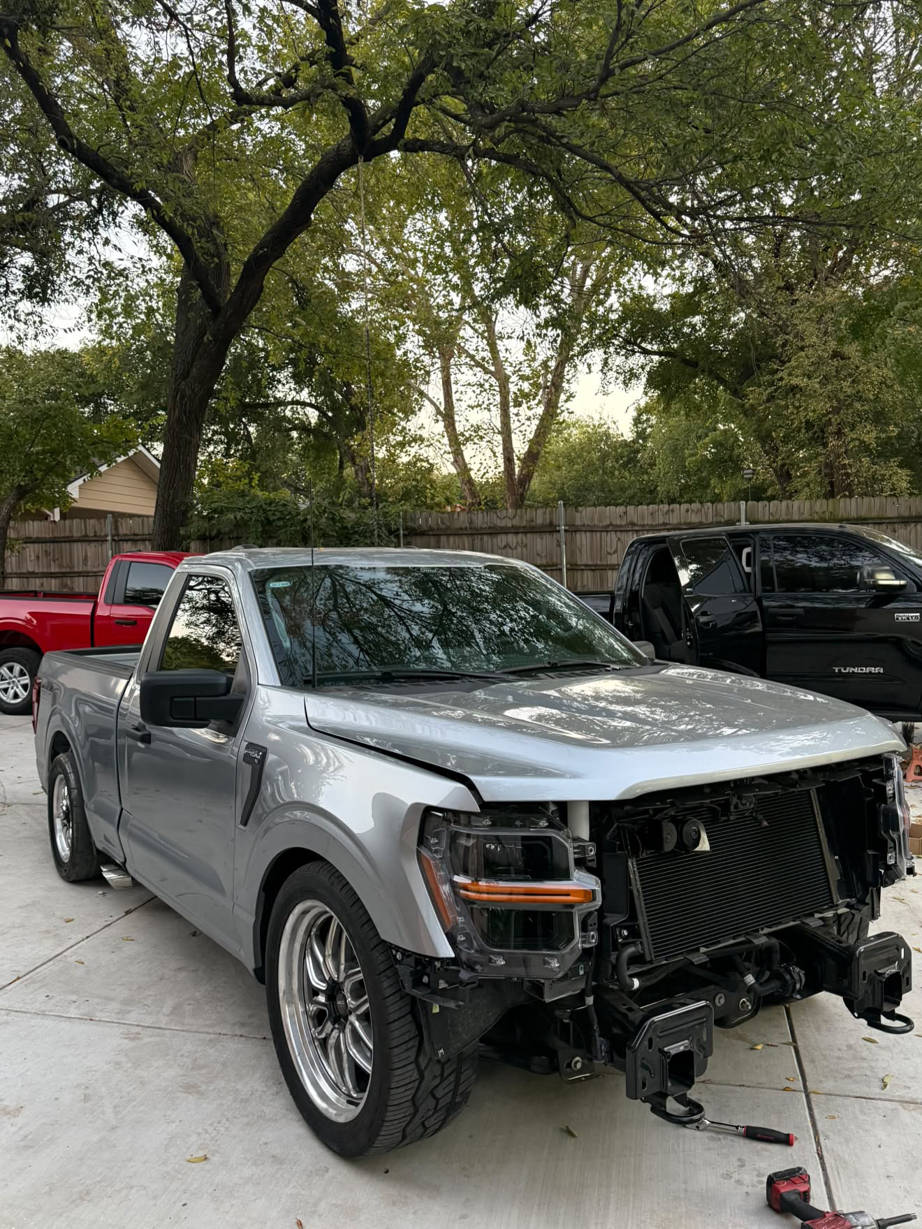 Silver Ford truck before front-end repair